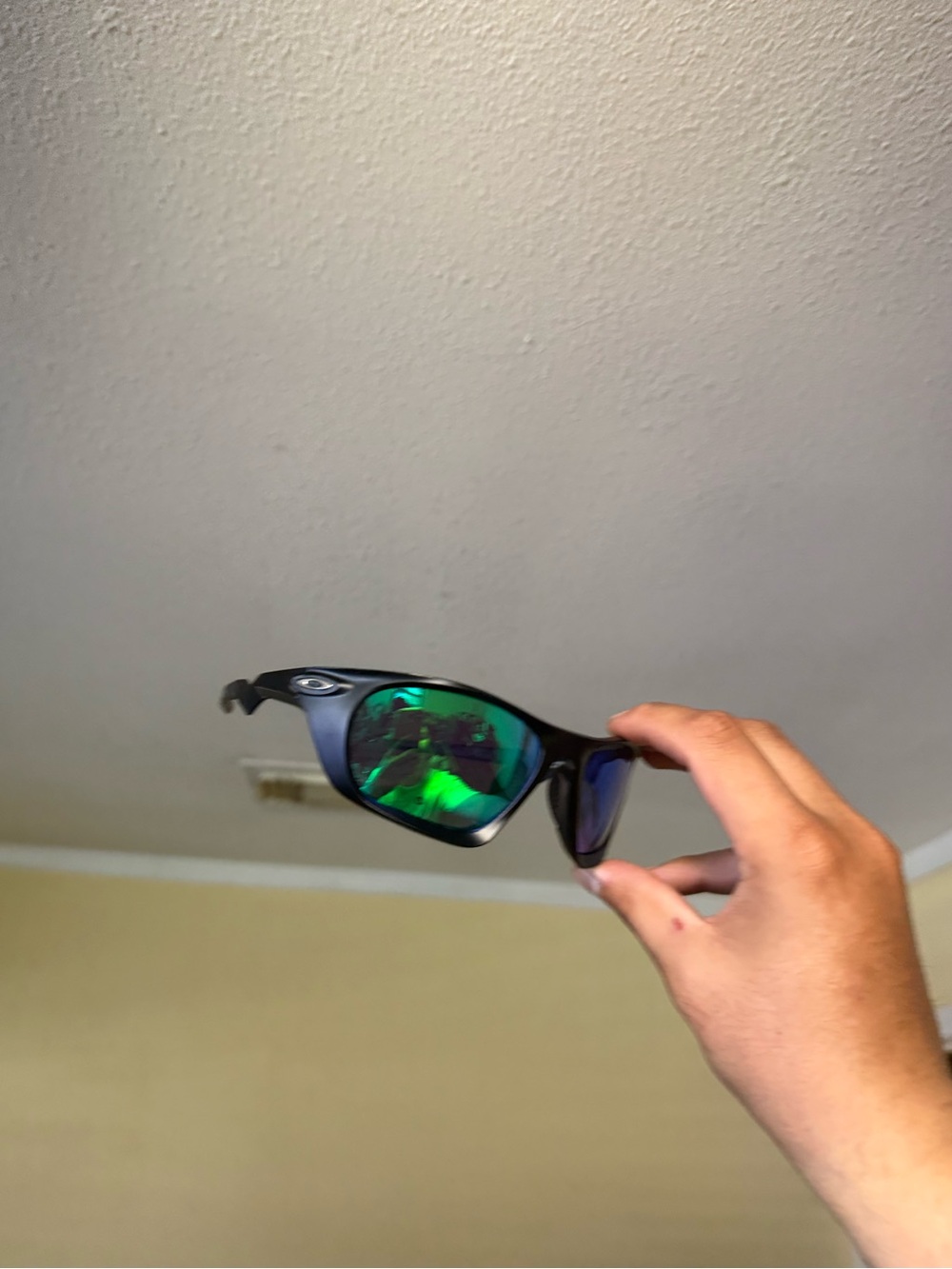 Oakley Black Frame Sunglasses with Green Mirror Lenses